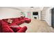 Finished basement with carpet, large sectional sofa, and built-in shelving at 161 Highgrove Dr, Suwanee, GA 30024