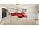 Finished basement with large sectional sofa, built-in shelving, and bonus space at 161 Highgrove Dr, Suwanee, GA 30024