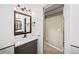Bathroom features modern fixtures, vanity with warm wood trim and a view into an adjoining carpeted space at 161 Highgrove Dr, Suwanee, GA 30024
