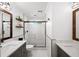 Bright bathroom with white tile, sleek fixtures, and a modern glass shower at 161 Highgrove Dr, Suwanee, GA 30024