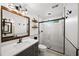 Modern bathroom featuring a glass enclosed shower, floating shelves, and a stylish vanity with warm wood trim at 161 Highgrove Dr, Suwanee, GA 30024