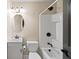 Cozy bathroom features white fixtures, vanity, and bathtub with shower at 161 Highgrove Dr, Suwanee, GA 30024