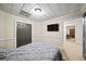 Bedroom featuring closet space and a modern wall-mounted television at 161 Highgrove Dr, Suwanee, GA 30024