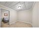 Neutral bedroom space featuring a tiled ceiling and comfortable gray bed at 161 Highgrove Dr, Suwanee, GA 30024