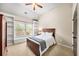 Bedroom with vaulted ceilings, and window seat with built-in shelving at 161 Highgrove Dr, Suwanee, GA 30024