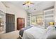 Bedroom with vaulted ceilings, and window seat with built-in shelving at 161 Highgrove Dr, Suwanee, GA 30024