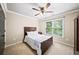 Bedroom with natural light, ceiling fan, and cozy carpet at 161 Highgrove Dr, Suwanee, GA 30024