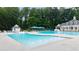 Large community pool area with fountains and plenty of space for lounging and swimming at 161 Highgrove Dr, Suwanee, GA 30024