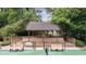 Covered viewing deck overlooking the tennis court at 161 Highgrove Dr, Suwanee, GA 30024