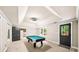Bright game room with a billiard table, neutral walls, and access to the outside at 161 Highgrove Dr, Suwanee, GA 30024