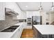 Beautiful kitchen featuring white cabinetry, stainless steel appliances, and center island with quartz countertop at 161 Highgrove Dr, Suwanee, GA 30024