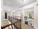 Upstairs landing featuring wrought iron railing and views into other rooms at 161 Highgrove Dr, Suwanee, GA 30024