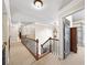 Spacious upstairs landing area featuring neutral paint, carpet, and decorative iron railing at 161 Highgrove Dr, Suwanee, GA 30024