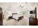 Expansive primary bedroom with tray ceiling, neutral carpet, and abundant natural light from multiple windows at 161 Highgrove Dr, Suwanee, GA 30024