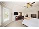 Spacious bedroom with tray ceiling, carpet, and a ceiling fan at 161 Highgrove Dr, Suwanee, GA 30024