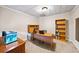 Bright home office featuring a desk, shelving, and an aquarium at 161 Highgrove Dr, Suwanee, GA 30024