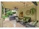 Inviting covered patio featuring a comfortable seating area and hot tub, perfect for entertaining or relaxing at 161 Highgrove Dr, Suwanee, GA 30024
