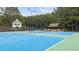 Well-maintained tennis court featuring benches, gazebo and lighting at 161 Highgrove Dr, Suwanee, GA 30024