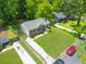 Aerial view of a well-kept house with green lawns and driveway at 2115 Pinehurst Dr, East Point, GA 30344