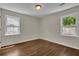 Bright bedroom with two windows and hardwood floors at 2115 Pinehurst Dr, East Point, GA 30344