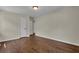 Bright bedroom with hardwood floors and neutral walls at 2115 Pinehurst Dr, East Point, GA 30344
