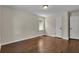 This bedroom is light and bright with hardwood floors and two doors at 2115 Pinehurst Dr, East Point, GA 30344