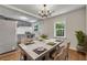 Inviting dining room with a modern table set for a meal, next to the kitchen at 2115 Pinehurst Dr, East Point, GA 30344