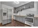 Well-equipped kitchen featuring stainless steel appliances and ample cabinet space at 2115 Pinehurst Dr, East Point, GA 30344