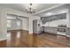 Open-concept kitchen with modern appliances and hardwood flooring, seamlessly connecting to the living area at 2115 Pinehurst Dr, East Point, GA 30344