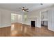 Spacious living room featuring hardwood floors, a fireplace, and an open layout at 2115 Pinehurst Dr, East Point, GA 30344