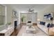 Cozy living room with comfortable seating, a fireplace, and stylish decor at 2115 Pinehurst Dr, East Point, GA 30344