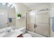 The bathroom features a shower-tub combo with sliding glass doors, tile floors, and a vanity at 2565 Holcomb Springs Dr, Alpharetta, GA 30022