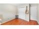 This is a simply decorated room with wood floors, a closet, and a guitar hanging on the wall at 2565 Holcomb Springs Dr, Alpharetta, GA 30022