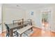 Dining room with a wooden table, bench, and hardwood floors at 2565 Holcomb Springs Dr, Alpharetta, GA 30022