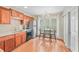Charming kitchen featuring wood cabinets, stainless steel appliances, and a breakfast nook near the window at 2565 Holcomb Springs Dr, Alpharetta, GA 30022