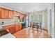Cozy kitchen features warm wood cabinets, stainless steel appliances, and an adjacent dining area at 2565 Holcomb Springs Dr, Alpharetta, GA 30022
