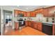 Well-lit kitchen showcasing wood cabinets, stainless steel appliances, and ample counter space at 2565 Holcomb Springs Dr, Alpharetta, GA 30022