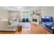 Bright, open living room with hardwood floors, fireplace, and comfortable seating at 2565 Holcomb Springs Dr, Alpharetta, GA 30022