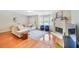 Spacious living room with hardwood floors, fireplace, bay window, and comfortable seating at 2565 Holcomb Springs Dr, Alpharetta, GA 30022