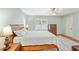 This is a main bedroom with a ceiling fan, a queen bed, hardwood floors, and a window at 2565 Holcomb Springs Dr, Alpharetta, GA 30022