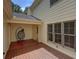 Relaxing outdoor patio with a hanging chair, wooden deck, and windows to the home at 2565 Holcomb Springs Dr, Alpharetta, GA 30022