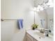 This is a powder room with a sink, mirror, flower arrangement, and a towel bar at 2565 Holcomb Springs Dr, Alpharetta, GA 30022