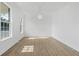 Bright dining room with a decorative chandelier, white walls, and light wood-look floors at 327 Awendaw Cir, Ellenwood, GA 30294