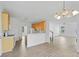 Bright kitchen with wood cabinets, white countertops, and stainless steel appliances, open to the living area at 327 Awendaw Cir, Ellenwood, GA 30294