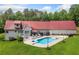 Aerial view of backyard features an in-ground pool, deck, and well-maintained lawn at 425 Chadwick Pl, Canton, GA 30114