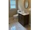 Bright bathroom features a tiled floor, and a modern vanity with neutral paint and fixtures at 425 Chadwick Pl, Canton, GA 30114
