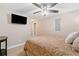 Bedroom with a ceiling fan and mounted television, creating a relaxing atmosphere at 425 Chadwick Pl, Canton, GA 30114