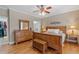 Cozy bedroom with hardwood floors, a wooden bed frame, and a walk-in closet at 425 Chadwick Pl, Canton, GA 30114
