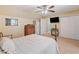 Bedroom with a ceiling fan and en suite bathroom, offering comfortable living space at 425 Chadwick Pl, Canton, GA 30114