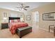 Comfortable bedroom featuring a ceiling fan, plush carpet, and ample natural light at 425 Chadwick Pl, Canton, GA 30114
